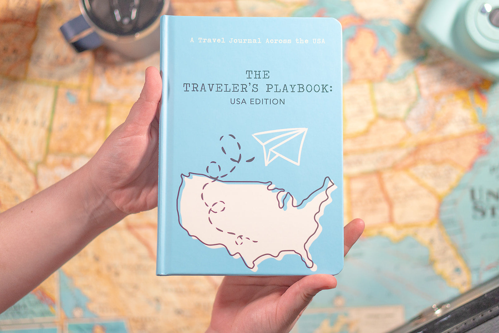 USA travel journal in front of a US map